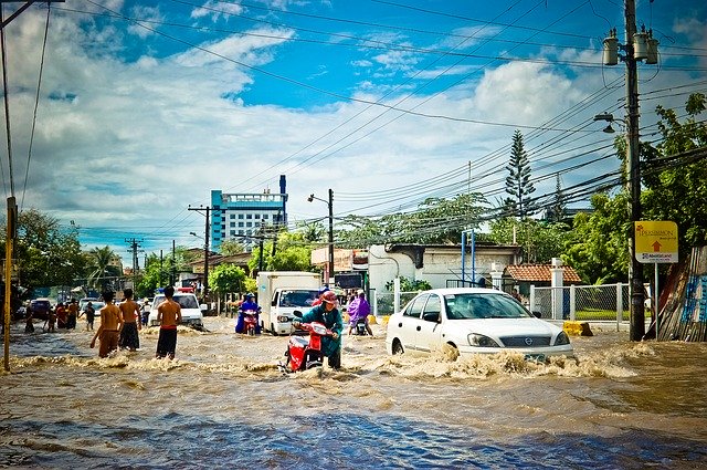 People walking on flooded street