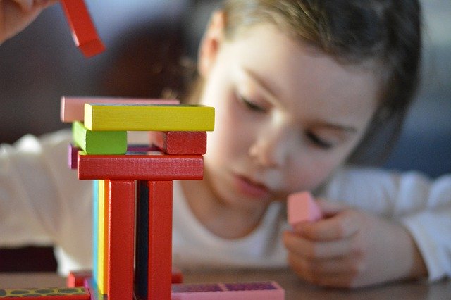 preschooler playing with blocks