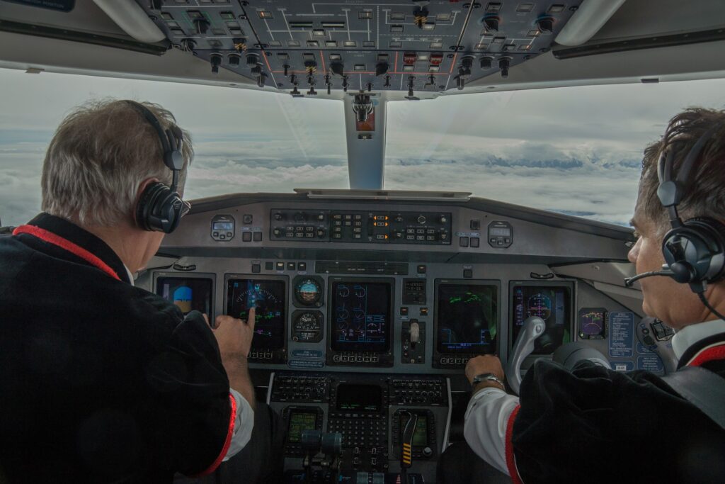 two pilots in flight cockpit