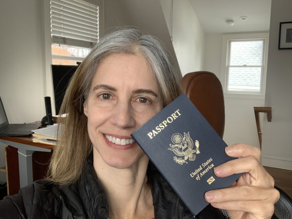 woman holding her U.S. passport